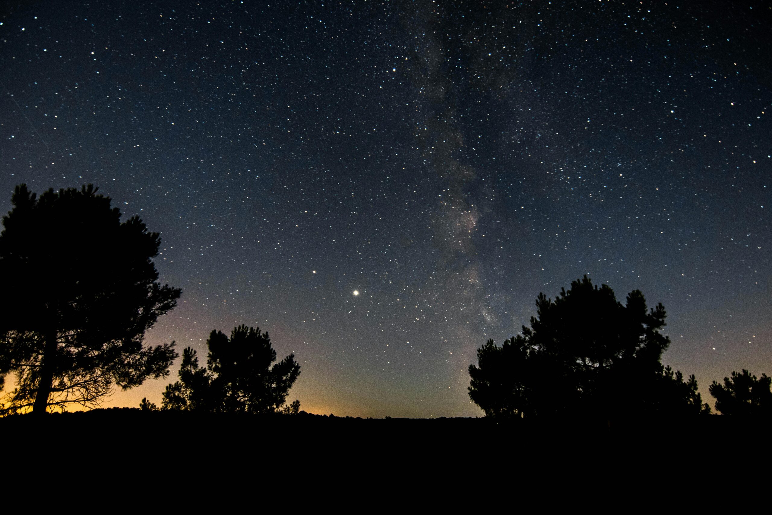 Explore the captivating cosmos and Milky Way under a starry night in France's picturesque countryside.
